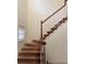 View of a staircase showing the treads, risers, and handrail with exposed wood, ready for refurbishment at 7123 Williamsburg Dr, Riverdale, GA 30274