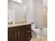 Well-lit bathroom featuring dark cabinets, granite countertops, and a soaking tub at 1903 Anjaco Rd # 5, Atlanta, GA 30309