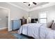 Spacious bedroom featuring a ceiling fan, hardwood flooring, and an ensuite bathroom at 1903 Anjaco Rd # 5, Atlanta, GA 30309
