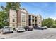 Exterior view of brick and tan apartment building with parking and manicured landscaping at 1903 Anjaco Rd # 5, Atlanta, GA 30309