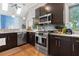 Bright kitchen with stainless appliances, dark cabinets, light countertops and modern features at 1903 Anjaco Rd # 5, Atlanta, GA 30309