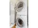 Efficient laundry area featuring a stacked washer and dryer set for space-saving convenience at 1903 Anjaco Rd # 5, Atlanta, GA 30309