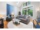 Bright living room with a large window, modern furnishings and a picturesque outdoor view at 1903 Anjaco Rd # 5, Atlanta, GA 30309