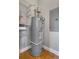 Hot water tank in a utility room with shelving and an electrical panel at 1903 Anjaco Rd # 5, Atlanta, GA 30309