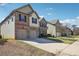 Two-story home with brick and siding, showcasing its driveway and suburban setting at 416 Culloden Moor Dr, Mcdonough, GA 30253