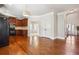 Open kitchen layout flowing into a dining area with hardwood floors and ample lighting at 416 Culloden Moor Dr, Mcdonough, GA 30253