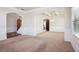 Spacious living room with neutral carpet, archways, and coffered ceiling detail at 416 Culloden Moor Dr, Mcdonough, GA 30253