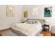 Bright bedroom featuring a bed with a gray frame and light-colored bedding and decor at 240 Mado Ln, Chattahoochee Hills, GA 30268