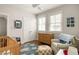 Bedroom featuring hardwood floors, lots of light, and a cloud-patterned rug at 240 Mado Ln, Chattahoochee Hills, GA 30268