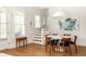 Cozy dining room featuring lots of natural light, hardwood floors, and modern decor at 240 Mado Ln, Chattahoochee Hills, GA 30268