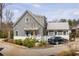 Charming home exterior featuring gray siding, a metal roof, and well-maintained landscaping with off street parking at 240 Mado Ln, Chattahoochee Hills, GA 30268