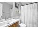 Clean bathroom with white subway tile, updated vanity, modern fixtures, and a patterned shower curtain at 3000 Storybook Ln, Grayson, GA 30017