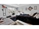 Bedroom with black bedspread, desk area, and a light-filled window at 3000 Storybook Ln, Grayson, GA 30017