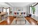 Bright living room featuring hardwood floors, neutral paint, a large window and comfortable seating at 3000 Storybook Ln, Grayson, GA 30017