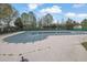 Community pool covered with safety cover, surrounded by patio and landscaping at 3000 Storybook Ln, Grayson, GA 30017
