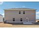 Back exterior of home with simple lines and an enclosed backyard at 345 Orwell Dr, Social Circle, GA 30025