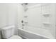 Clean, all-white bathroom with a shower-tub combo and modern fixtures at 345 Orwell Dr, Social Circle, GA 30025