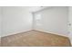 Clean and bright bedroom with neutral carpeting and a window for natural light at 345 Orwell Dr, Social Circle, GA 30025