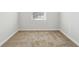 Neutral bedroom with carpeting and a single window providing natural light at 345 Orwell Dr, Social Circle, GA 30025