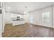 Kitchen dining area with an island, pendant lighting, and stainless steel appliances at 345 Orwell Dr, Social Circle, GA 30025