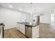 Modern kitchen with stainless steel appliances, stone countertops and an island with a sink at 345 Orwell Dr, Social Circle, GA 30025