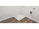 Laundry room with wood-look flooring and hookups for a washer and dryer at 345 Orwell Dr, Social Circle, GA 30025