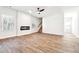 Living room with a modern fireplace, large windows, and stairs at 345 Orwell Dr, Social Circle, GA 30025