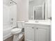 Well-lit bathroom featuring a shower-tub combo, vanity with storage, and modern fixtures at 4319 Alysheba Dr, Fairburn, GA 30213