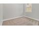Cozy carpeted bedroom with a window, freshly painted and ready for personal touches at 4319 Alysheba Dr, Fairburn, GA 30213