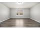 A bare room with gray walls, and new flooring, ready to be furnished as your perfect retreat at 4319 Alysheba Dr, Fairburn, GA 30213