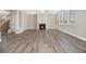 Spacious living area featuring a fireplace and new flooring, perfect for entertaining at 4319 Alysheba Dr, Fairburn, GA 30213