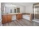 Elegant main bathroom featuring double sinks, a separate shower, and a luxurious soaking tub at 4319 Alysheba Dr, Fairburn, GA 30213