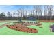 Aerial view of community amenities featuring a gazebo and playground surrounded by green space at 456 Reflection Dr # 20, Stockbridge, GA 30281
