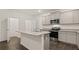 Modern kitchen with stainless steel appliances, granite countertops, and a kitchen island at 456 Reflection Dr # 20, Stockbridge, GA 30281