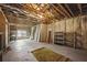 Unfinished basement area with exposed ceiling, concrete floor, and windows for potential customization at 627 Warsaw Rd, Roswell, GA 30075