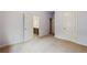 Bedroom featuring neutral colored carpet and white painted trim and doors at 627 Warsaw Rd, Roswell, GA 30075
