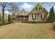 Charming craftsman home with stone accents, mature landscaping, and inviting curb appeal at 627 Warsaw Rd, Roswell, GA 30075