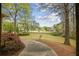 Inviting front yard view showcasing the home's manicured landscaping and a welcoming walkway at 627 Warsaw Rd, Roswell, GA 30075