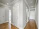 Hallway with hardwood floors, recessed lighting and white trim at 627 Warsaw Rd, Roswell, GA 30075