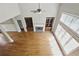 Open living room featuring a fireplace, hardwood floors and built-in shelving at 627 Warsaw Rd, Roswell, GA 30075