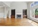 Living room features a fireplace, built-in shelving, and large windows at 627 Warsaw Rd, Roswell, GA 30075
