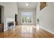 Spacious living room with hardwood floors and fireplace at 627 Warsaw Rd, Roswell, GA 30075
