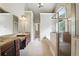 Main bathroom with double vanity, granite countertops, walk-in shower, and soaking tub at 627 Warsaw Rd, Roswell, GA 30075