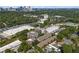 An aerial view of a neighborhood with mature trees and a city skyline in the distance at 818 Highland Green Ne Way # 818, Atlanta, GA 30306