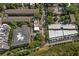 An aerial view of a neighborhood with mature trees and a city skyline in the distance at 818 Highland Green Ne Way # 818, Atlanta, GA 30306
