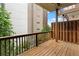 Wooden back deck with an outdoor seating area and views of the neighborhood at 818 Highland Green Ne Way # 818, Atlanta, GA 30306