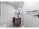Bathroom showcases a glass shower, wood vanity with a black faucet, and patterned tile floor at 818 Highland Green Ne Way # 818, Atlanta, GA 30306