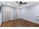 Light-filled bedroom with hardwood floors, a ceiling fan, and soft, light blue walls at 818 Highland Green Ne Way # 818, Atlanta, GA 30306
