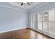 Bedroom with hardwood floors, plantation shutters, and a ceiling fan at 818 Highland Green Ne Way # 818, Atlanta, GA 30306