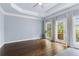 Light-filled bedroom with hardwood floors and direct access to the deck at 818 Highland Green Ne Way # 818, Atlanta, GA 30306
